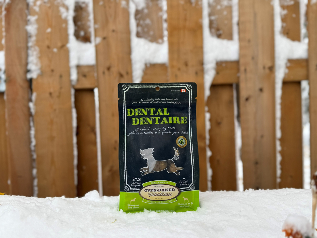 Oven-Baked Tradition dental treats bag in the snow for fresh breath and healthy teeth